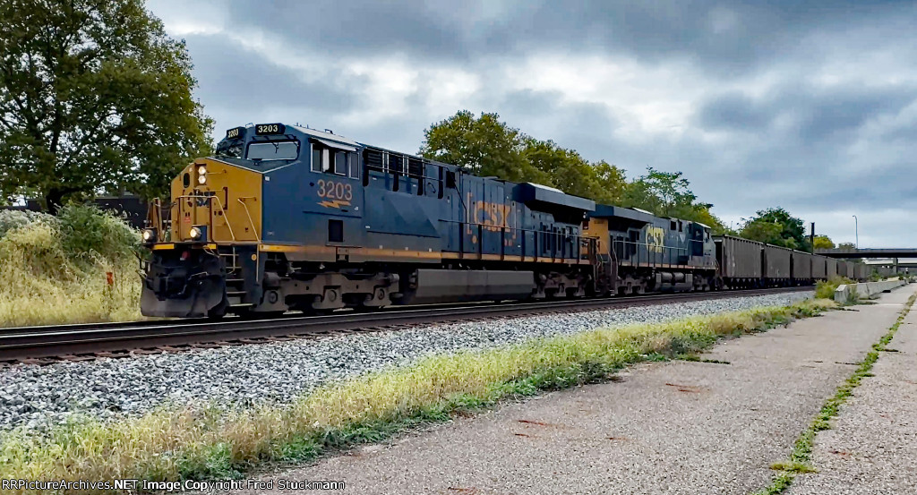 CSX 3203 is east with empty coal cars.